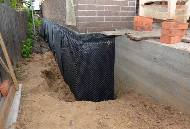 Happy homeowners after waterproofing job in Norris